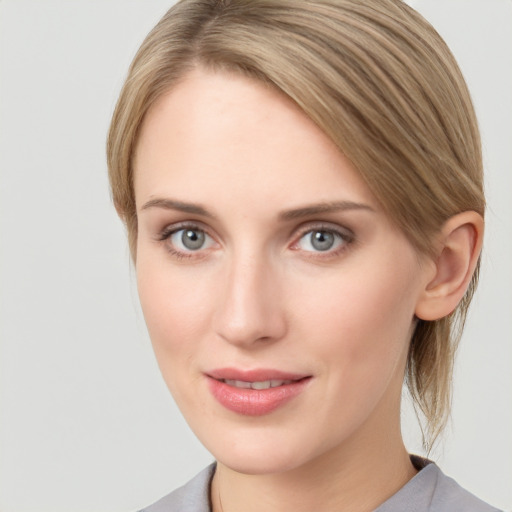 Joyful white young-adult female with medium  brown hair and blue eyes