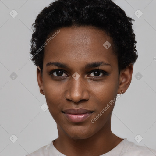 Joyful black young-adult female with short  black hair and brown eyes