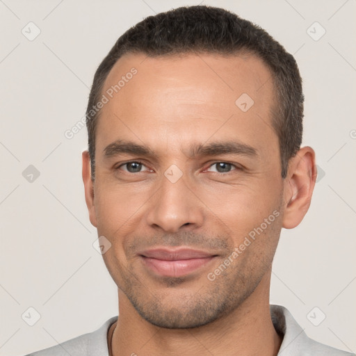 Joyful white young-adult male with short  brown hair and brown eyes