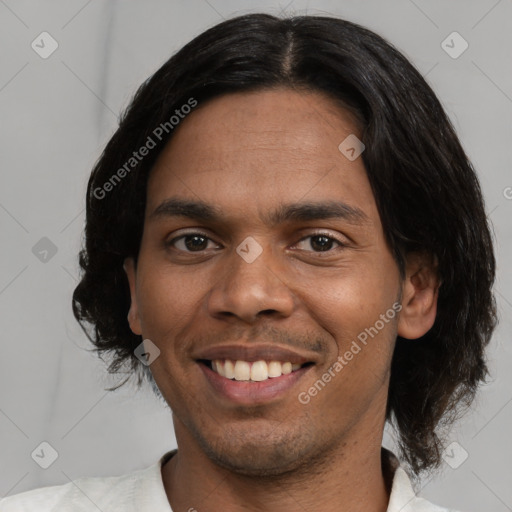 Joyful white young-adult male with short  black hair and brown eyes