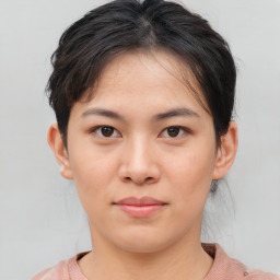 Joyful asian young-adult female with short  brown hair and brown eyes