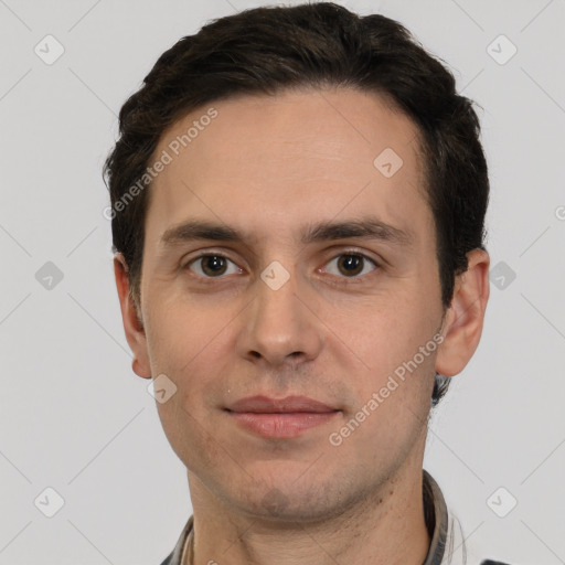 Joyful white young-adult male with short  brown hair and grey eyes