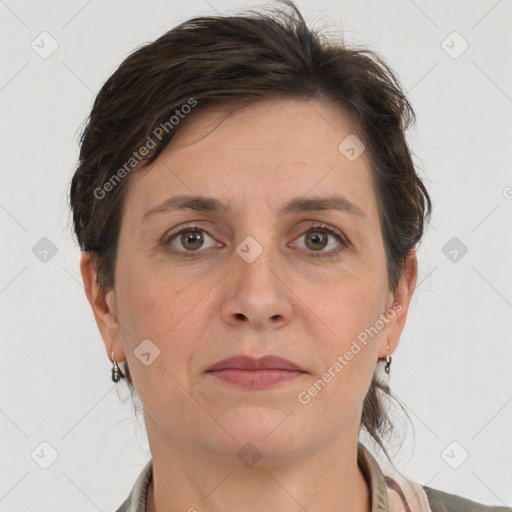 Joyful white adult female with medium  brown hair and grey eyes