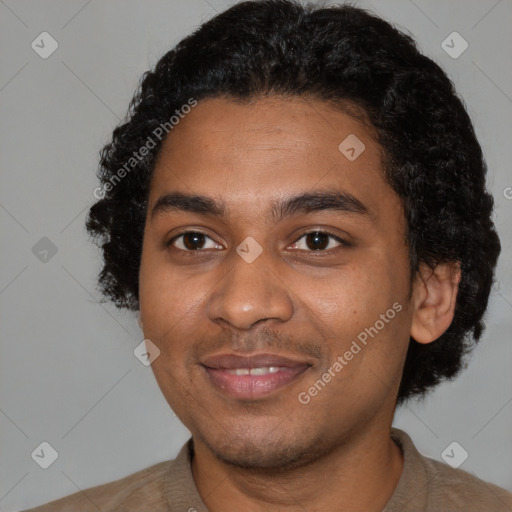 Joyful black young-adult male with short  black hair and brown eyes