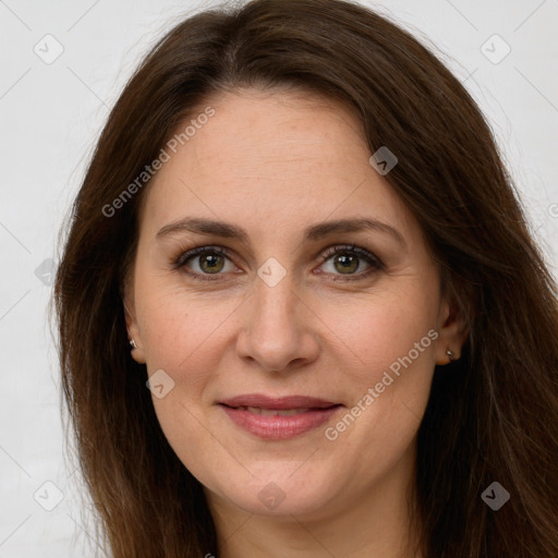 Joyful white adult female with long  brown hair and brown eyes