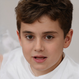 Joyful white child male with short  brown hair and brown eyes