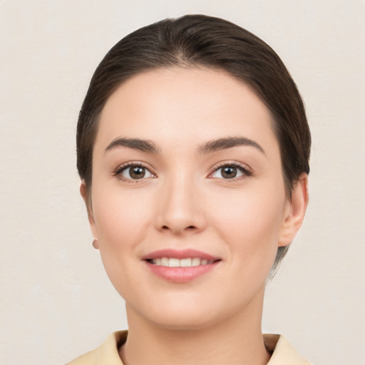 Joyful white young-adult female with medium  brown hair and brown eyes