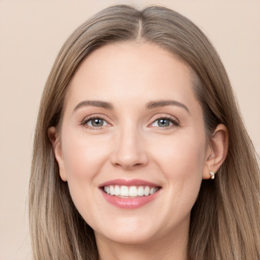 Joyful white young-adult female with long  brown hair and grey eyes