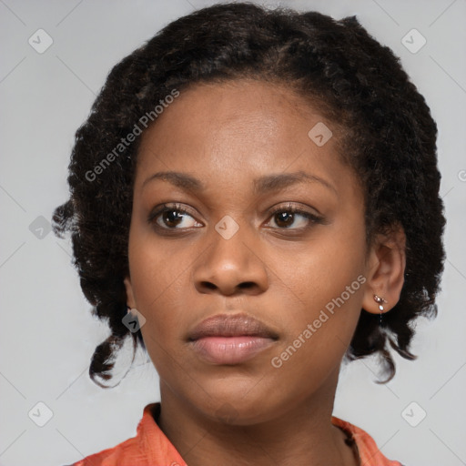 Neutral black young-adult female with medium  brown hair and brown eyes