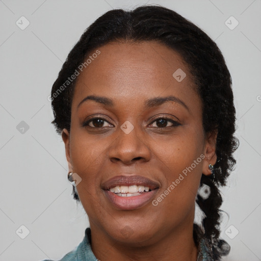 Joyful black young-adult female with medium  brown hair and brown eyes