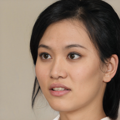 Neutral asian young-adult female with medium  black hair and brown eyes