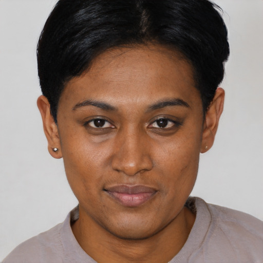 Joyful asian young-adult female with short  black hair and brown eyes