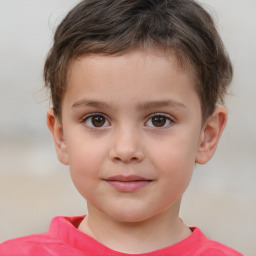 Joyful white child male with short  brown hair and brown eyes