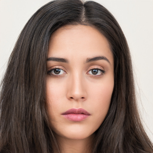 Neutral white young-adult female with long  brown hair and brown eyes