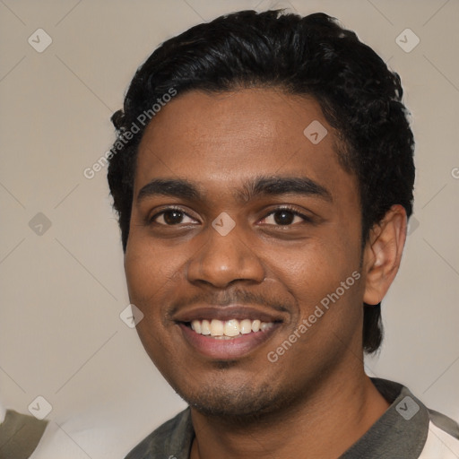 Joyful black young-adult male with short  black hair and brown eyes