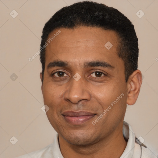 Joyful latino adult male with short  black hair and brown eyes