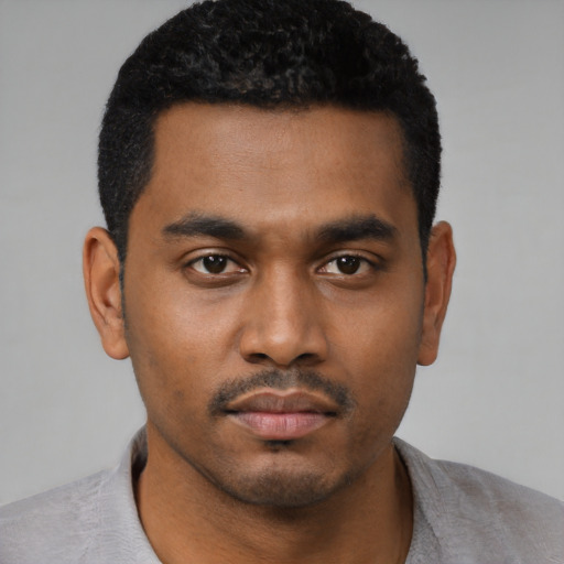 Neutral black young-adult male with short  black hair and brown eyes