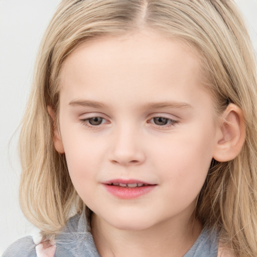 Joyful white child female with long  brown hair and blue eyes