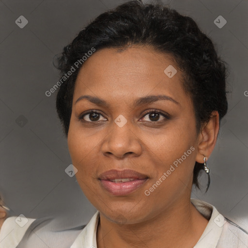 Joyful black adult female with short  brown hair and brown eyes