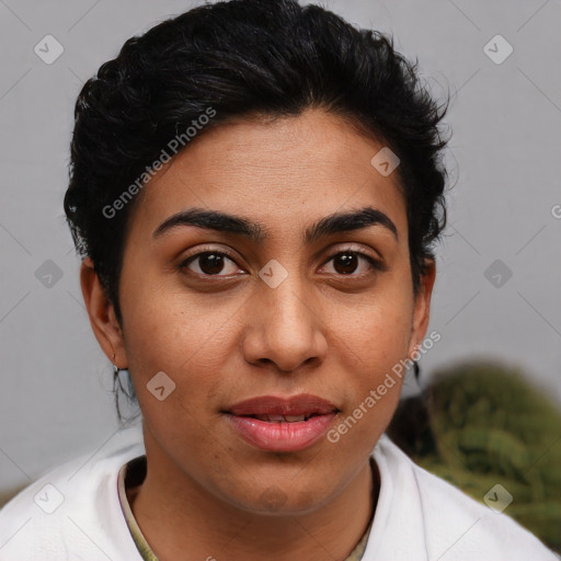 Joyful latino young-adult female with short  black hair and brown eyes