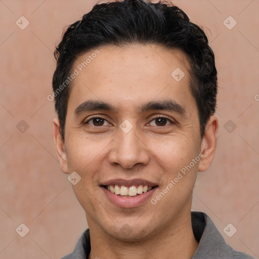 Joyful white young-adult male with short  black hair and brown eyes