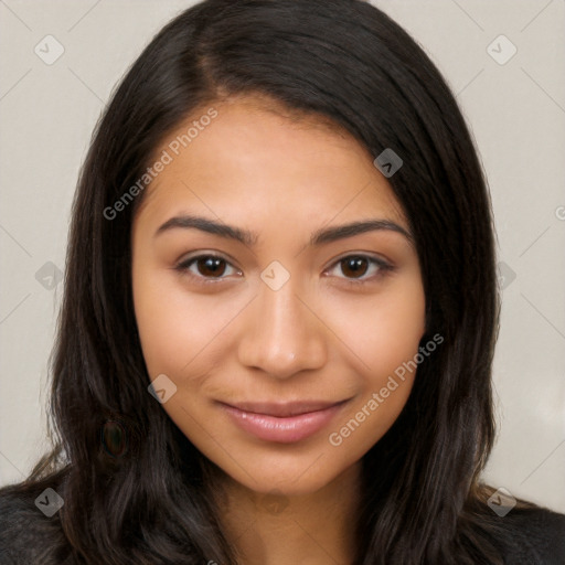 Joyful latino young-adult female with long  brown hair and brown eyes