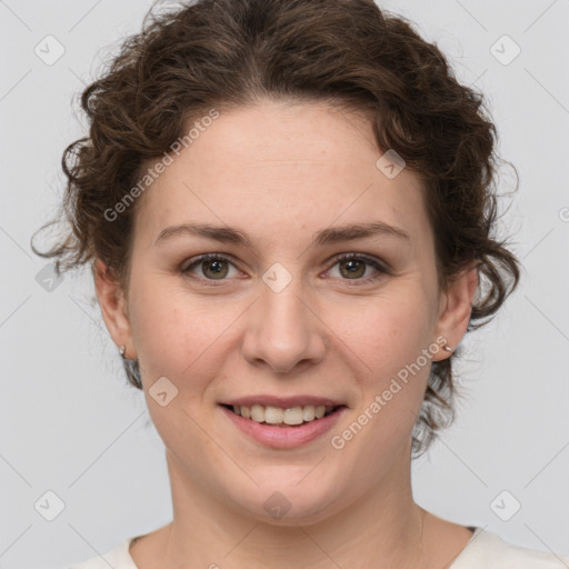 Joyful white young-adult female with medium  brown hair and green eyes