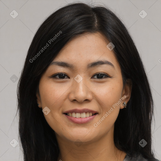 Joyful asian young-adult female with long  brown hair and brown eyes