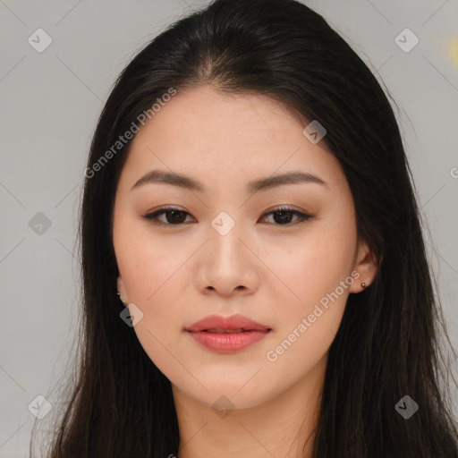 Joyful asian young-adult female with long  brown hair and brown eyes