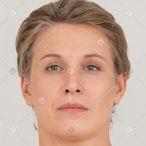 Joyful white adult female with short  brown hair and grey eyes