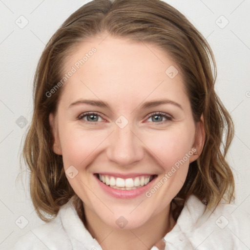 Joyful white young-adult female with medium  brown hair and blue eyes