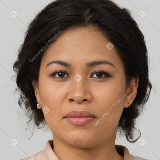 Joyful latino young-adult female with medium  brown hair and brown eyes