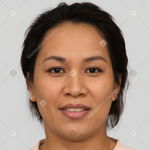 Joyful latino young-adult female with medium  brown hair and brown eyes