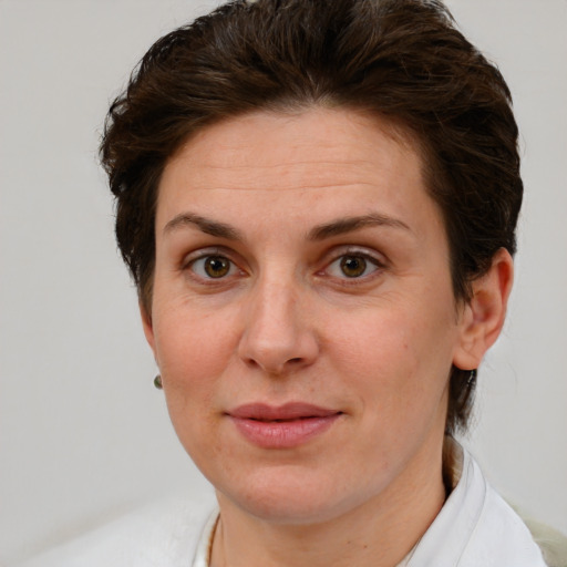 Joyful white adult female with short  brown hair and brown eyes