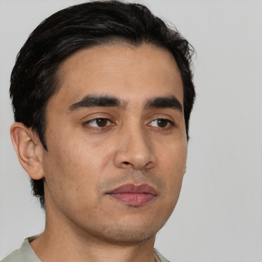 Neutral white young-adult male with short  black hair and brown eyes
