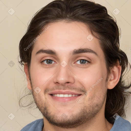 Joyful white young-adult male with medium  brown hair and brown eyes