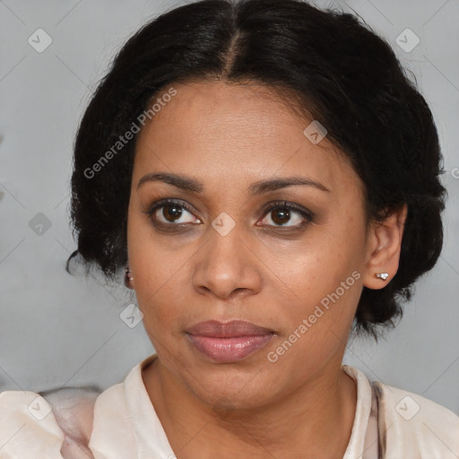 Joyful latino adult female with medium  brown hair and brown eyes