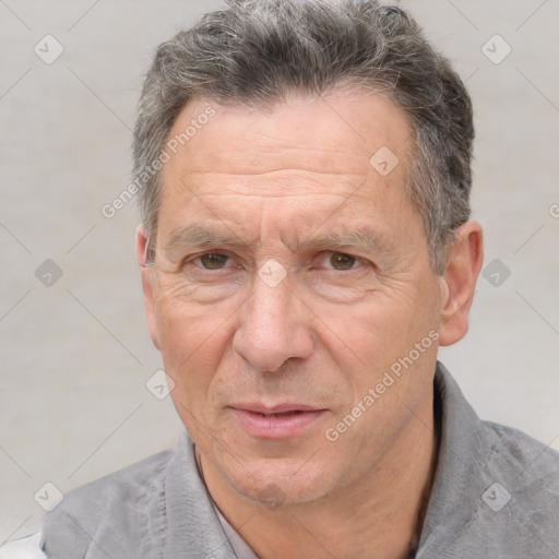 Joyful white middle-aged male with short  brown hair and brown eyes