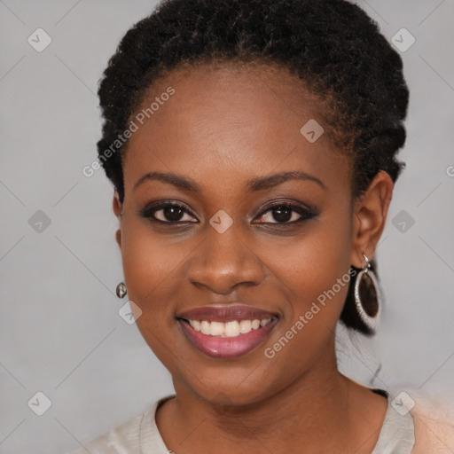 Joyful black young-adult female with short  brown hair and brown eyes