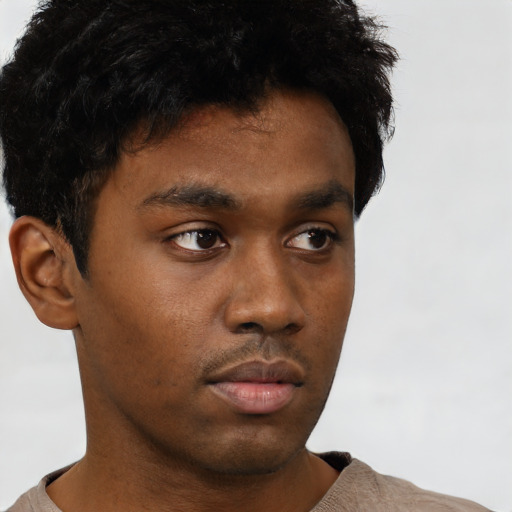 Neutral black young-adult male with short  brown hair and brown eyes