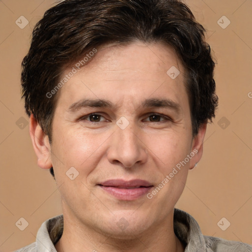 Joyful white adult male with short  brown hair and brown eyes