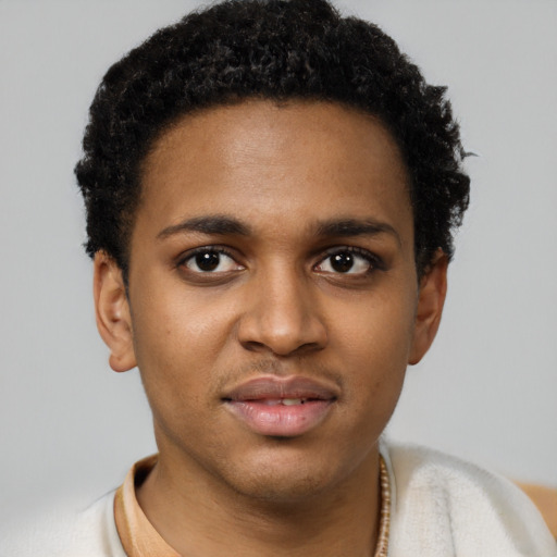 Joyful latino young-adult male with short  brown hair and brown eyes