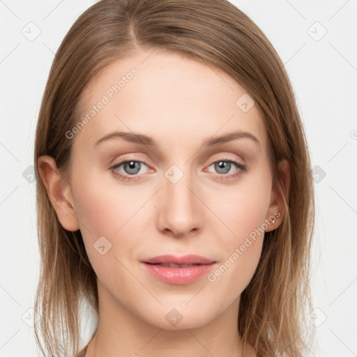 Joyful white young-adult female with long  brown hair and blue eyes