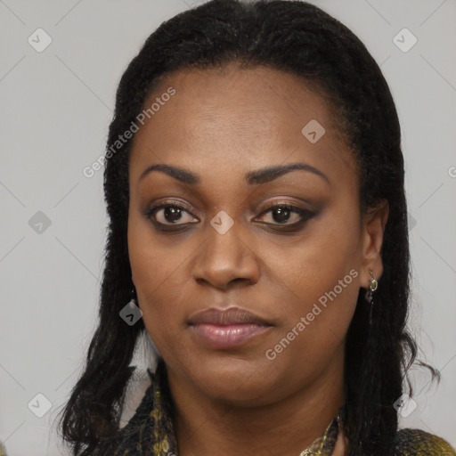 Joyful black young-adult female with long  black hair and brown eyes