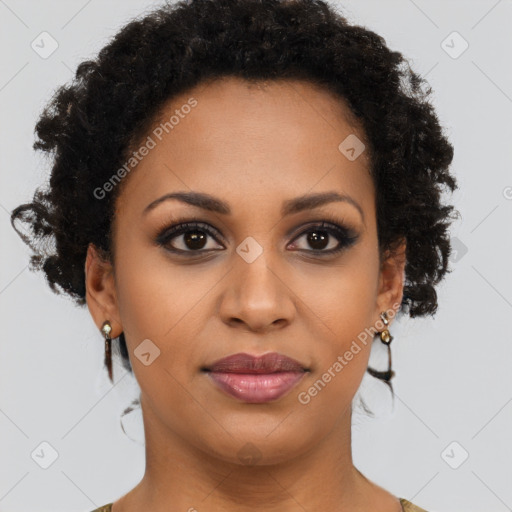 Joyful black young-adult female with long  brown hair and brown eyes