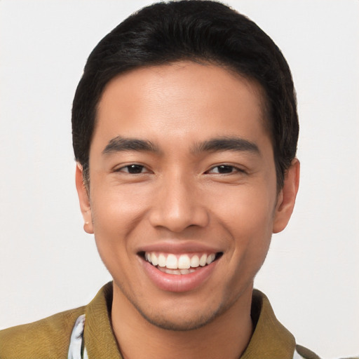 Joyful asian young-adult male with short  brown hair and brown eyes