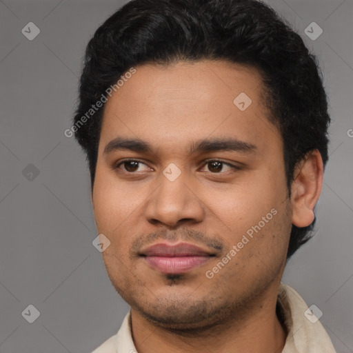 Joyful latino young-adult male with short  black hair and brown eyes