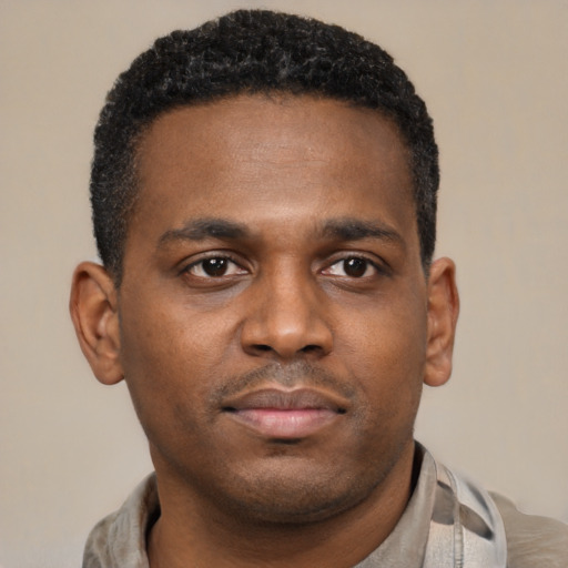 Neutral latino young-adult male with short  brown hair and brown eyes