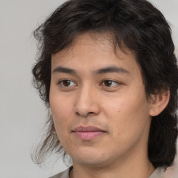 Joyful white young-adult male with medium  brown hair and brown eyes