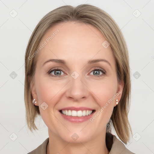 Joyful white young-adult female with medium  brown hair and blue eyes